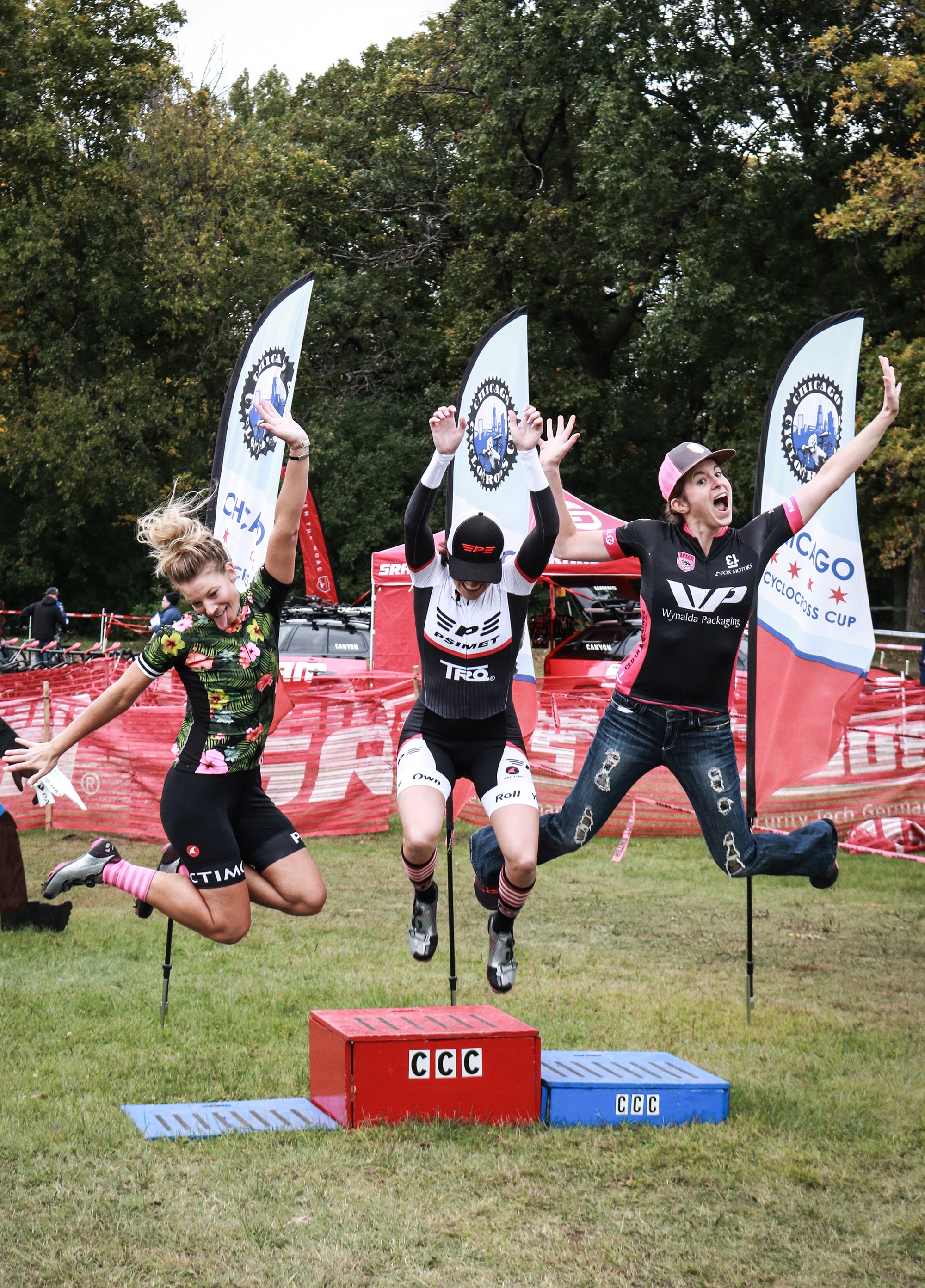 Women jumping from podium