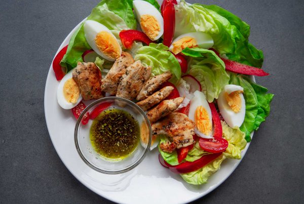 Salad with Grilled Chicken and Eggs preparation ready to eat