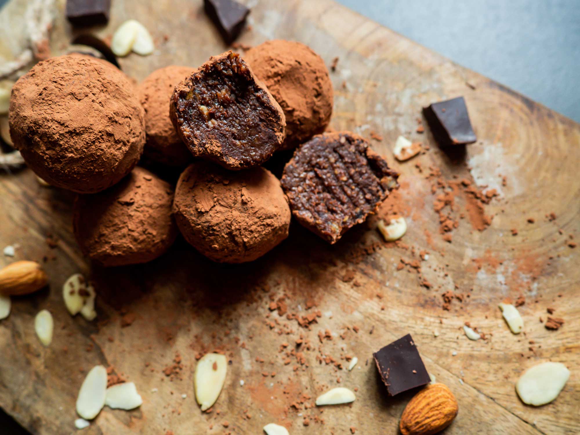 Power balls with dates and almonds sliced in half