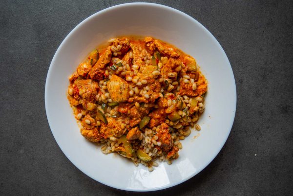 Pearl barley with chicken in zucchini and tomato sauce