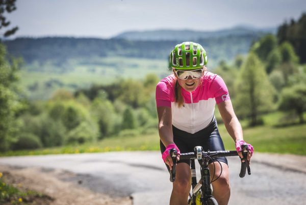 Woman no bike doing base training